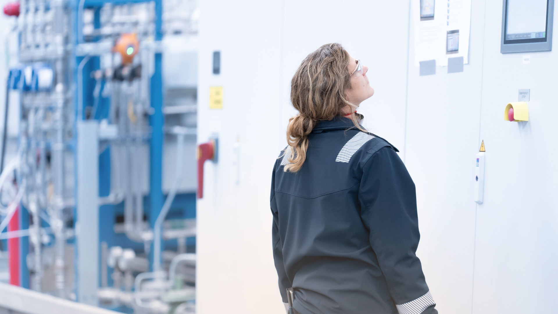 Operator monitoring the all-electric process control panel