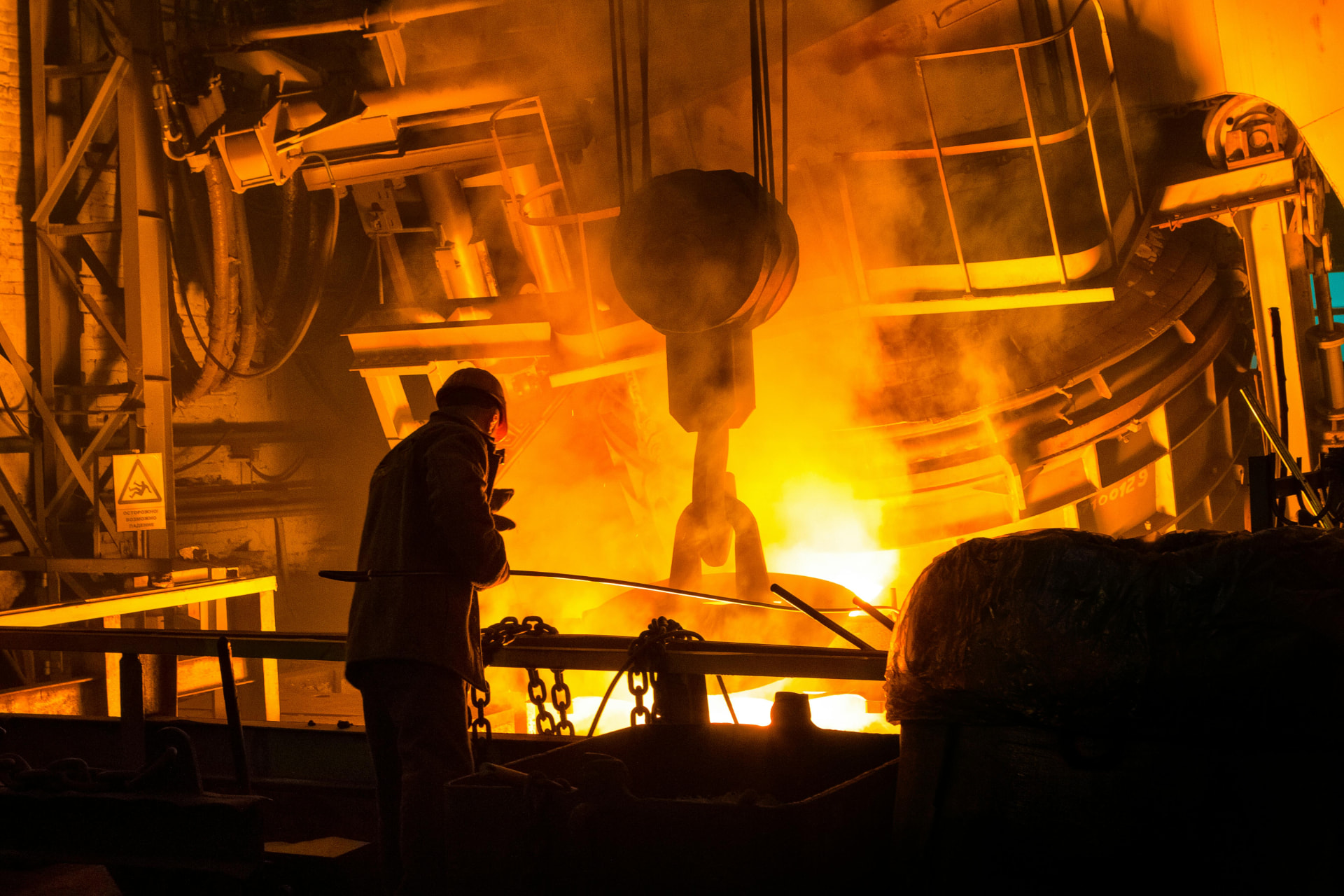 Operator working at a steel furnace